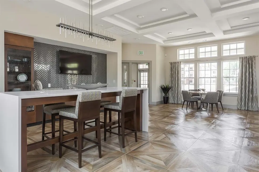 Open-plan kitchen and dining area with wide-plank hardwood flooring