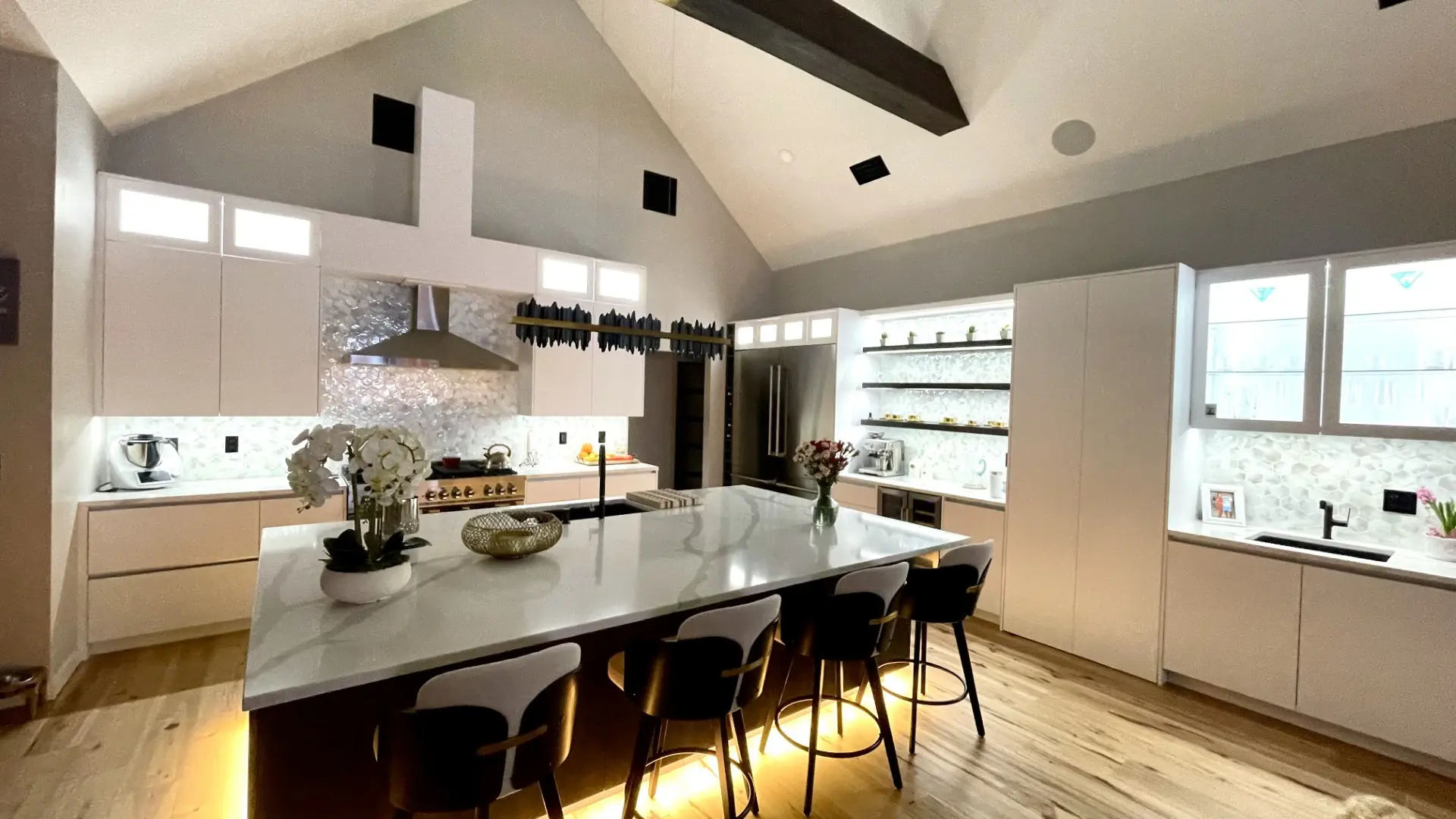 Residential kitchen with a large island, pendant lighting and adjoining dining area