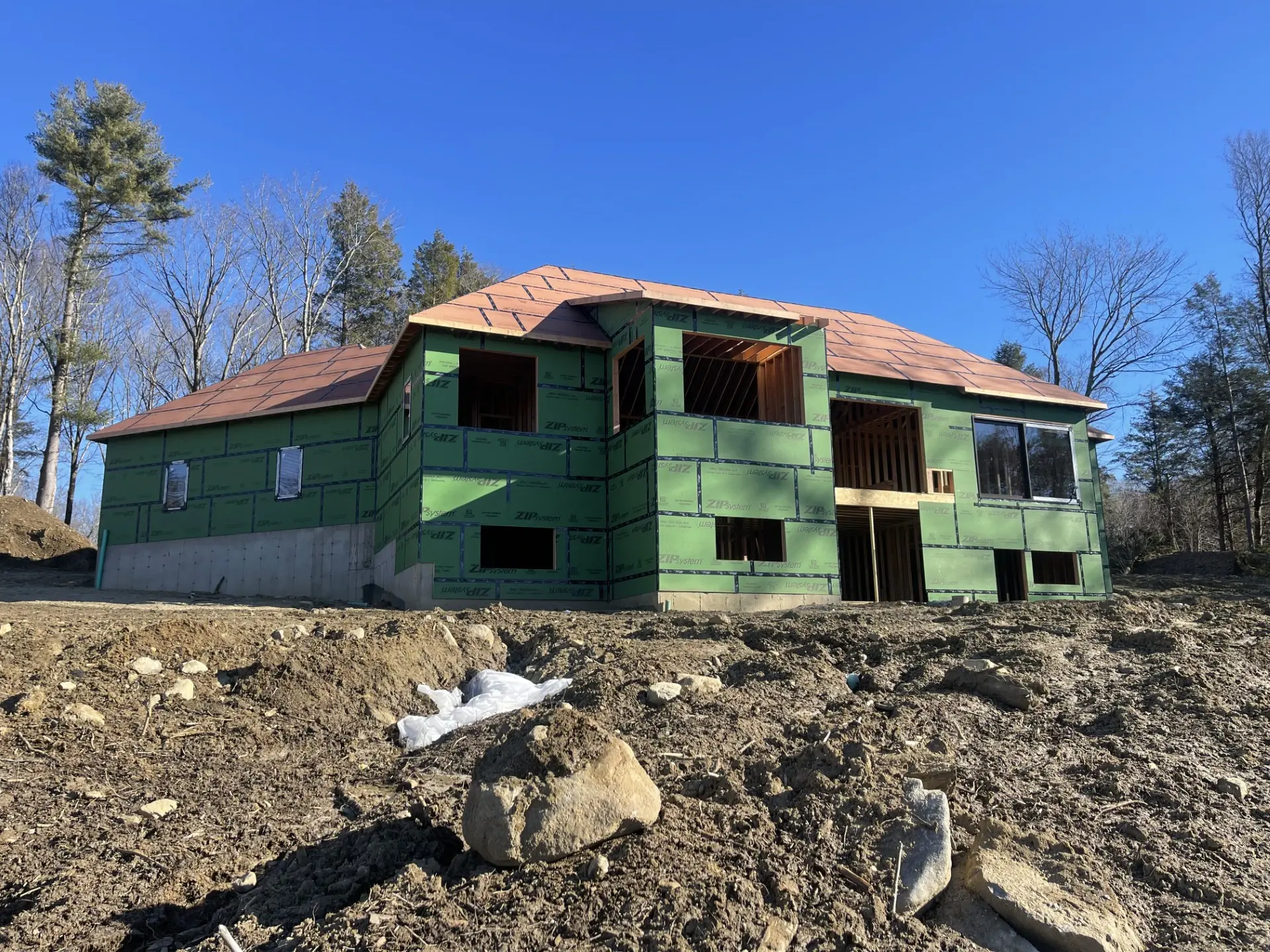 New home framed and sheathed, ready for windows and siding