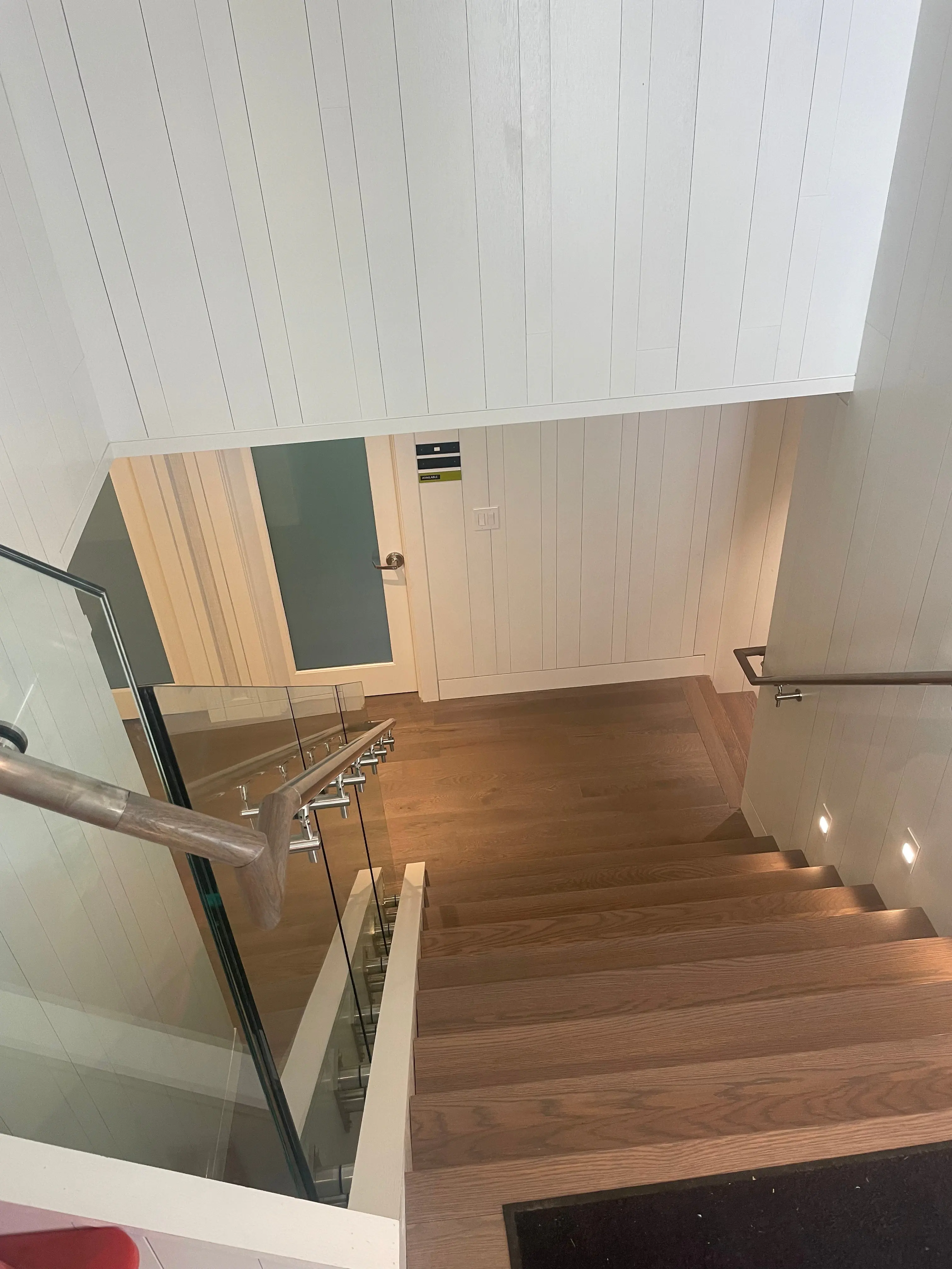 Custom staircase with wood treads and painted risers
