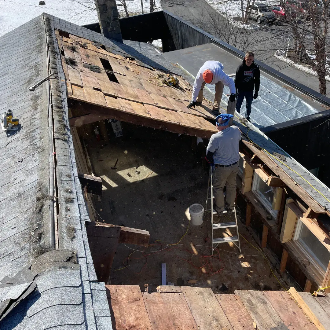 Crew laying floor framing on an addition project